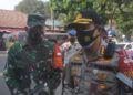 polisi terkait pencium jenazah