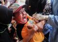 ekspresi siswa saat disuntik untuk imunisasi