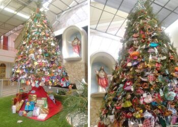 Pohon Natal yang berhiaskan masker di Gereja Kristus Raja Surabaya. (Foto: Rangga Aji/Tugu Jatim) pohon natal masker