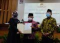 Calon Bupati dan Wakil Bupati Malang nomor urut satu, Muhammad Sanusi dan Didik Gatot Subroto, secara resmi ditetapkan sebagai Calon Bupati dan Wakil Bupati Malang terpilih oleh KPU Kabupaten Malang. (Foto: Rap/Tugu Jatim)