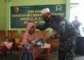 Kodim 0819 Pasuruan melakukan santunan kepada anak yatim di daerah Purwosari, Pasuruan, Jumat (12/2/2021). (Foto: Dokumen) tugu jatim