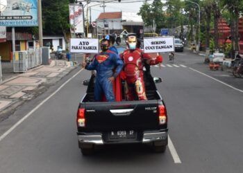 Kodim 0819 Pasuruan menggunakan cara unik untuk imbau protokol kesehatan kepada warga. (Foto: Dokumen) tugu jatim