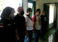 Tangkapan layar video permintaan maaf anggota Satreskoba Polresta Malang Kota terhadap Kol Chb I Wayan Sudarsana. (Foto: Azmy/Tugu Jatim)
