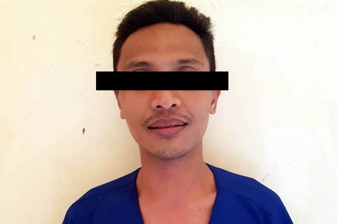 Muhammad Yusuf, mantan pegawai koperasi yang melakukan penipuan, diamankan di Polsek Wonorejo, Pasuruan, setelah membawa kabur uang warga. (Foto: Polsek Wonorejo/Tugu Jatim)