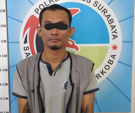 Tersangka BH saat diamankan Polrestabes Surabaya.