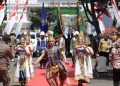Kirab Pataka Jer Basuki Mawa Beya Tiba di Tuban, Disambut Drum Band dan Kesenian Tradisional
